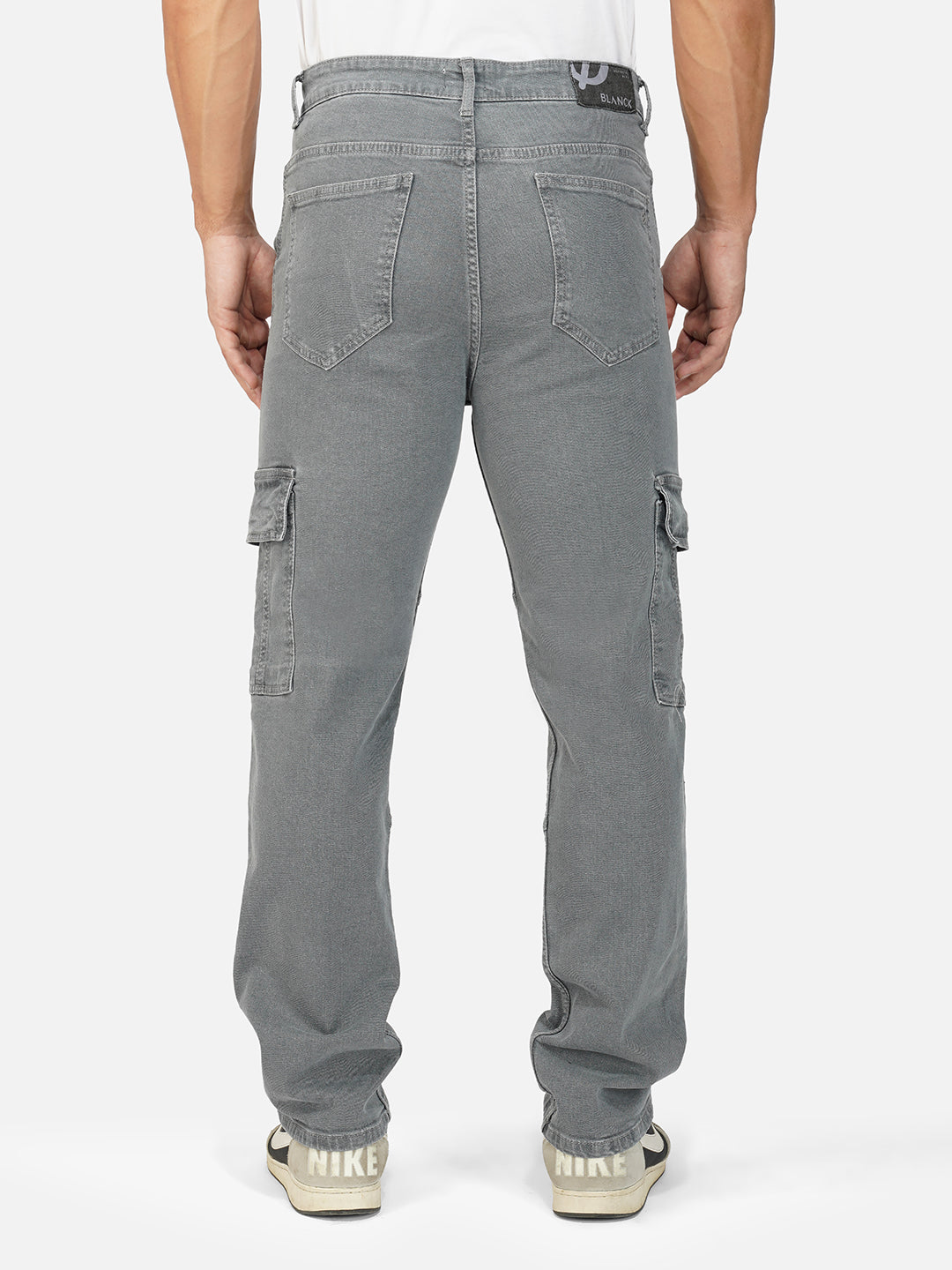 Back view of grey cargo pants with utility pocket detailing