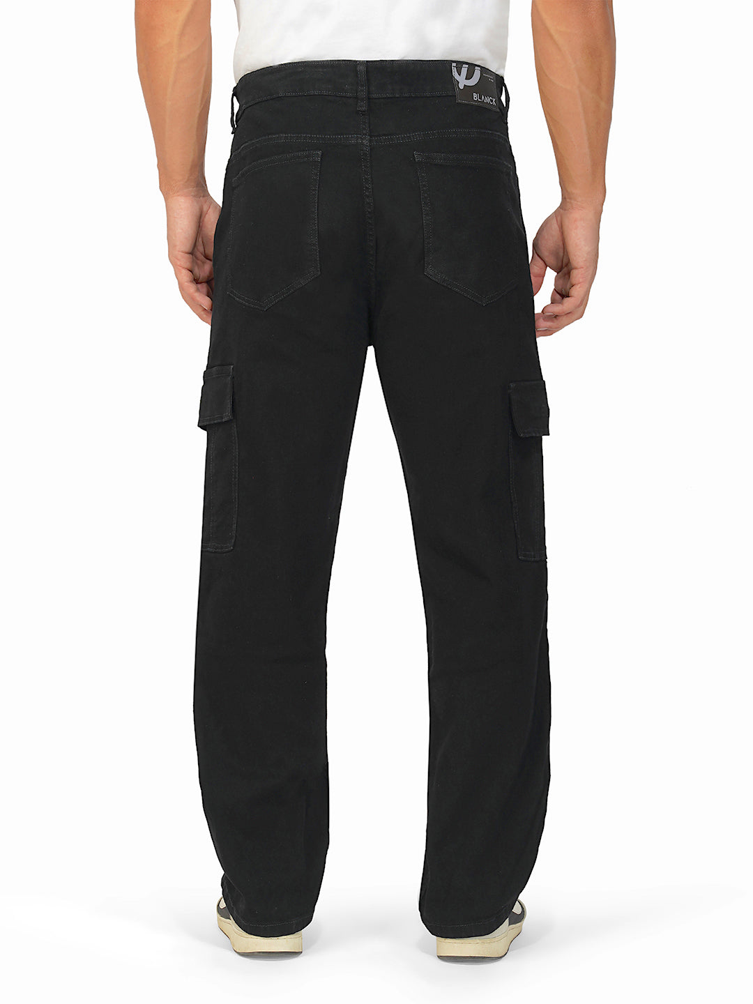 Rear view of black jeans showing pocket detailing and wide leg