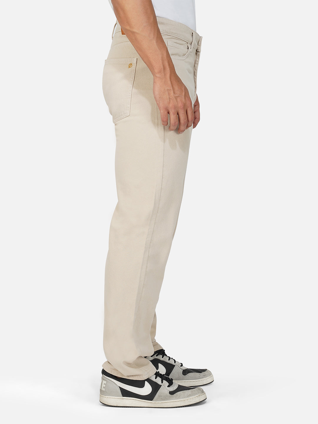 Side profile of ecru comfort jeans emphasizing straight leg cut.